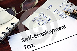 Paper with words self-employment tax.