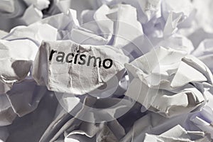 Paper written racismo, portuguese and spanish word for racism. C photo
