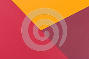 Paper yellow, burgundy, red empty background, geometrically located. Color blank for presentations, copy space