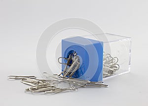 Paperclip and blue plastic box