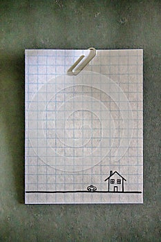 Paperclip on an empty white grid paper