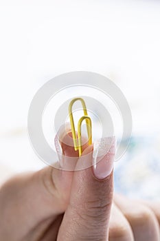 Paperclip in between two fingers