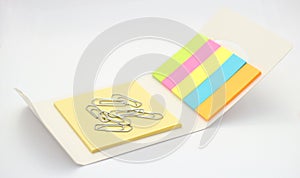 Paperclips with colorful notepads. Necessary equipment for office and school