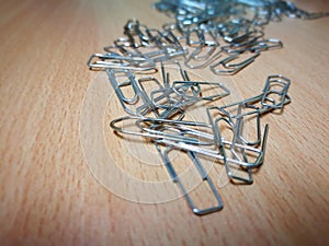Paperclips on a wooden desk