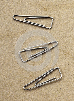 Paperclips on yellow background texture