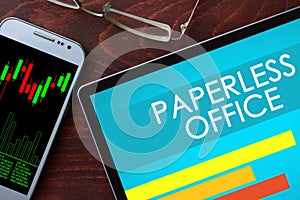 Paperless office written on a tablet.