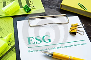 Papers about ESG Environmental, Social and Corporate Governance and notepad.