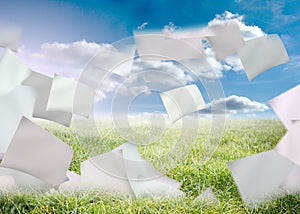 Papers flying against the sky