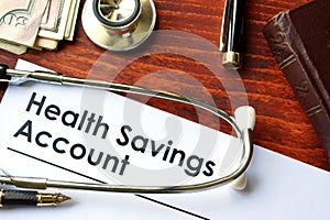 Papers with Health Savings Account HSA photo