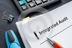 Papers with integrated audit report and calculator.