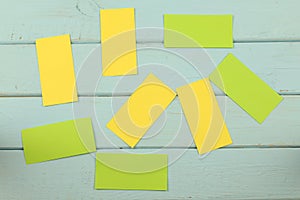 Papers for notes on a wooden background.