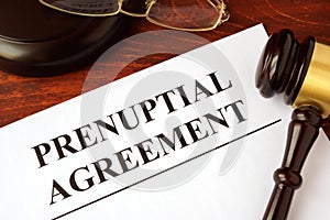 Papers with title prenuptial agreement. photo