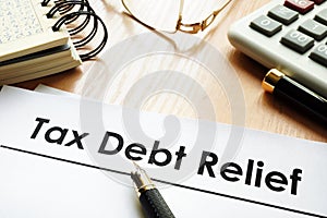 Papers with title tax debt relief. photo