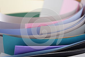 Papers with vivid, light, pastel colors.