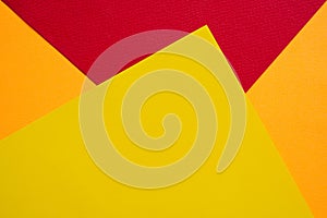 Papers yellow red orange chape background. photo