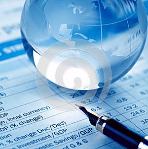 Paperweight and pen on report