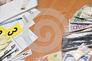 Paperwork during crime scene investigation process in csi laboratory. Evidence labels with fingerprint applicant and many