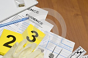 Paperwork during crime scene investigation process in csi laboratory. Evidence labels with fingerprint applicant and rubber gloves