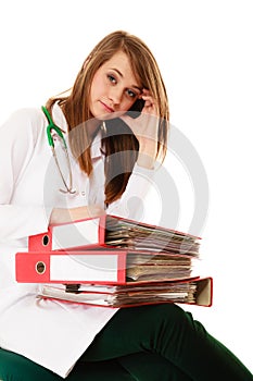 Paperwork. Overworked doctor woman with documents