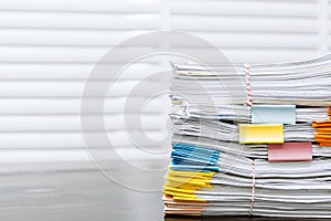 Paperwork pile print document unorganized put on the desk