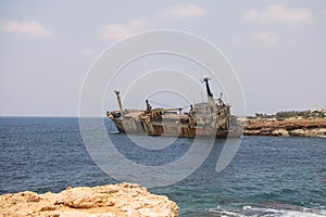 Paphos. Shipwreck. ship crashed on the coastal rocks at the shore of the Mediterranean sea. Tourist attractions of Cyprus