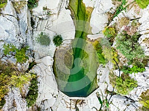 Papingo Rock Pools, also called ovires, natural green water pools located in small smooth-walled gorge near the village of Papingo