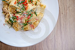 Pappardelle pasta italian with tomatoes, parmegiano reggiano cheese detail