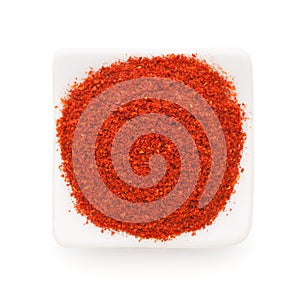 Paprika ground in a white bowl on white