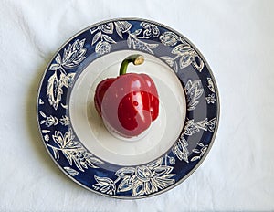 Paprika on a plate, white background