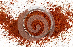 Paprika powder isolated on white background, top view