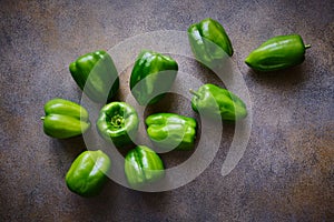 Paprika, ripe sweet green peppers scattered across the table, flat lay with copy space