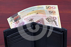 Papua New Guinean money in the black wallet photo