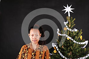 Papuan girl by Christmas tree