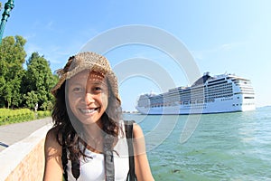 Papuan girl with ocean ship behind