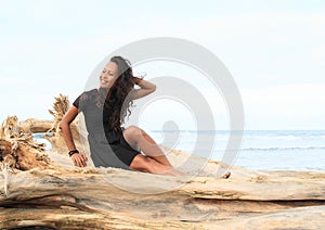 Papuan girl sitting on trunk