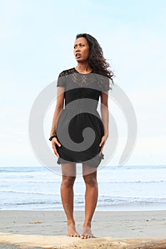 Papuan girl standing on beach