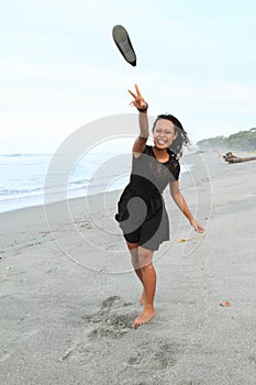 Papuan girl throwing a shoe