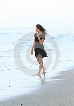 Papuan girl walking in sea