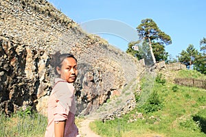 Serious girl walking on castle Girls Stone