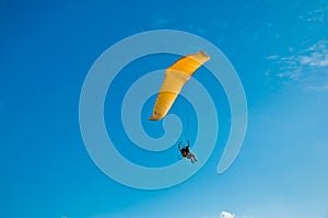 Para-glider in blue sky photo