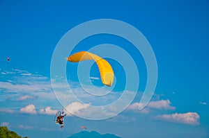 Para-gliders in blue sky photo