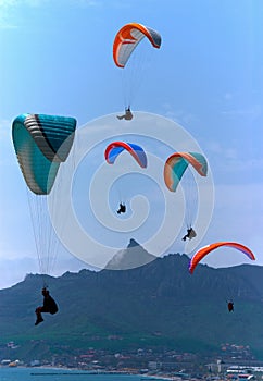 Para gliders soaring over the mountains