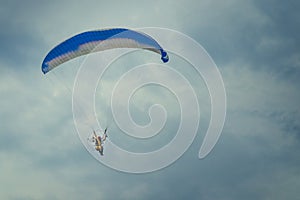 Para-motor flying on the sky.
