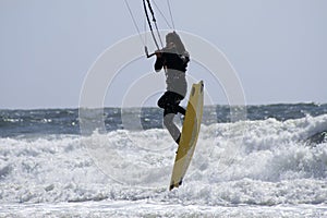 Para-surfer above ocean photo