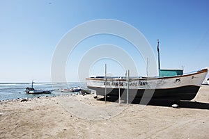 Paracas, Peru -Colorful old fishing boats in Paracas Bay in January 2015 in Ica, Peru. Paracas is a small port city that serves
