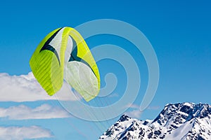 Parachute against the background of mountains and blue sky