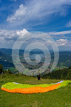 Parachute glider looking at hill over the Tegernsee in Germany