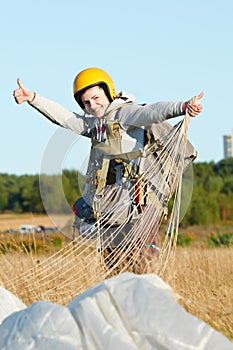 Parachute jumper after landing photo