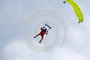 Parachute man landing down.