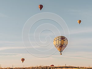 Parachutes flying up in the air during daytime